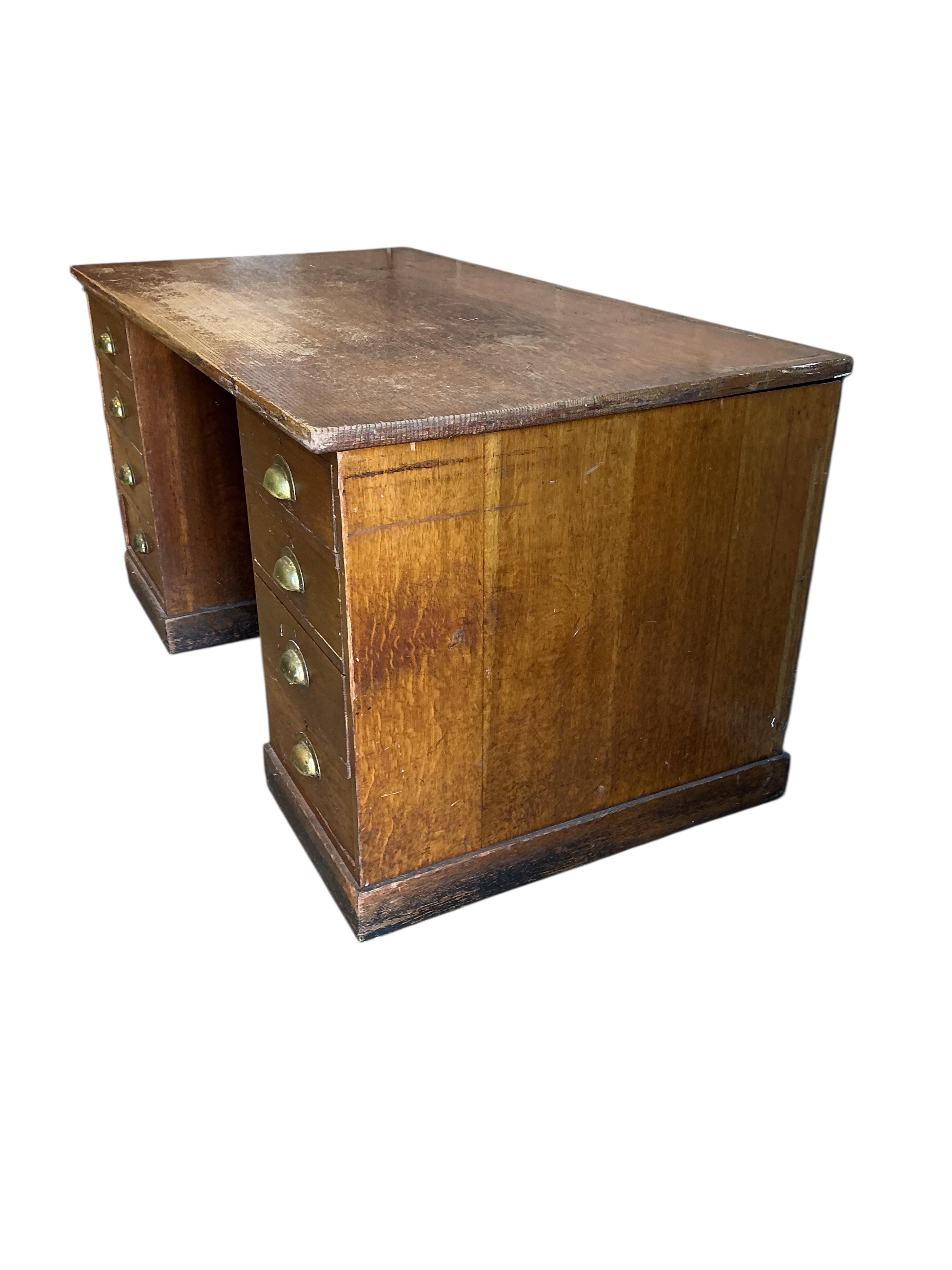An early 20th century oak pedestal desk, adapted, width 152cm, depth 83cm, height 77cm